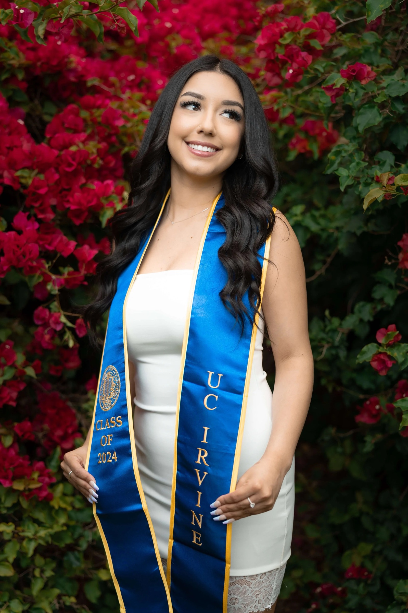 UCI graduate portrait in red flower area