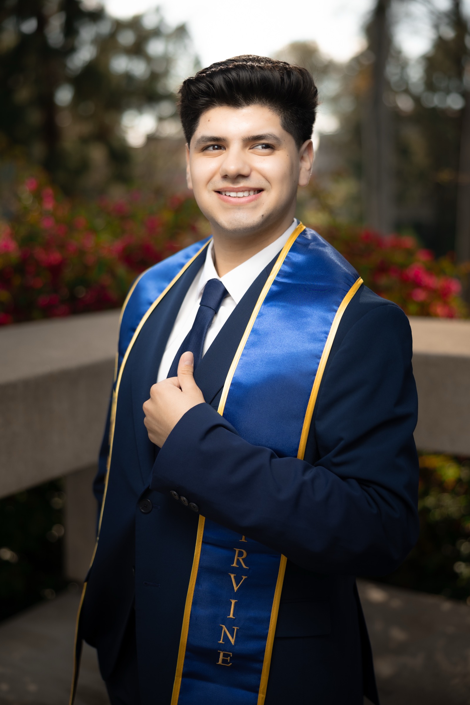 Graduate in campus walkway