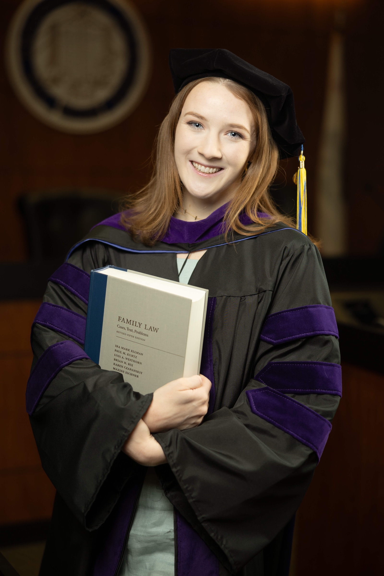 Graduate with campus architecture