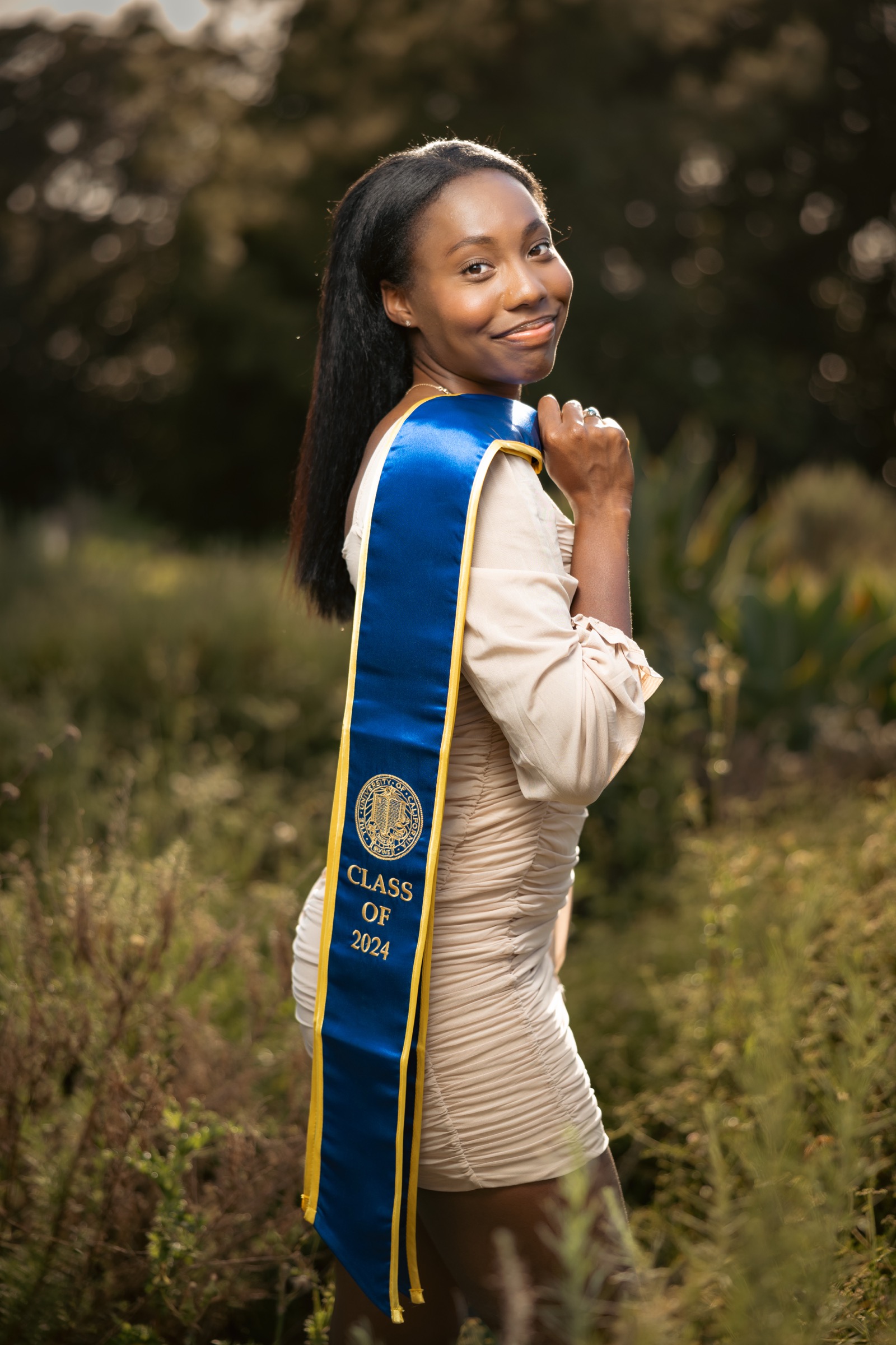 UCI graduate in golden hour garden