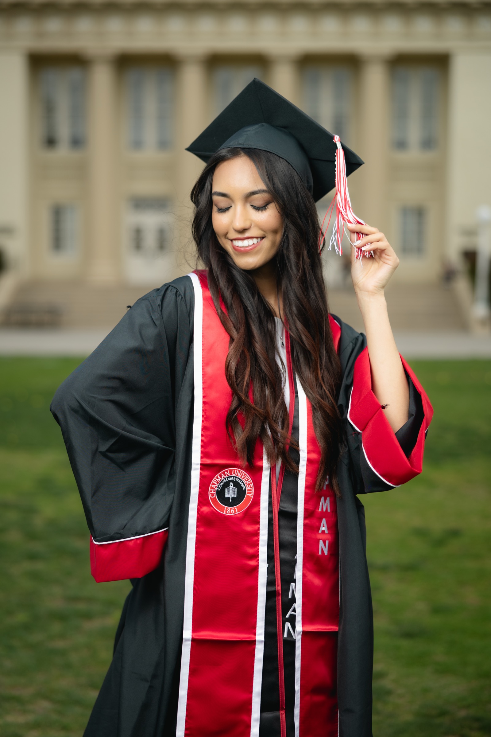 Chapman University graduate playing with tassel on cap