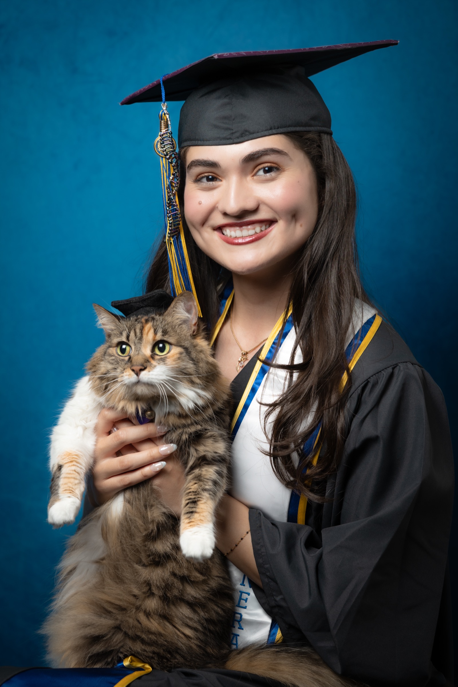 Graduate with cat graduation photo
