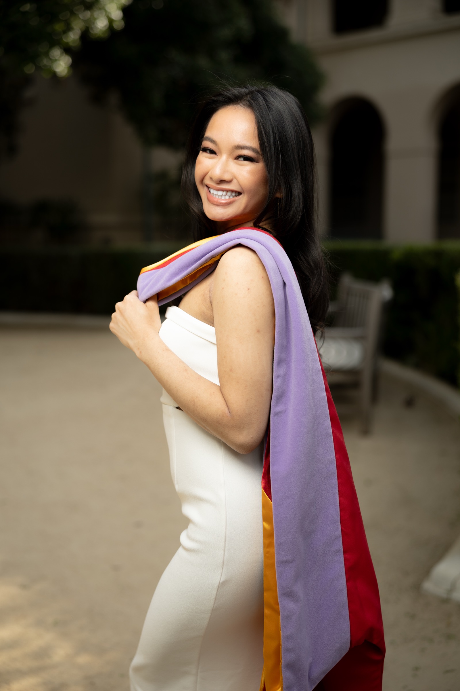 USC graduate with colorful sash