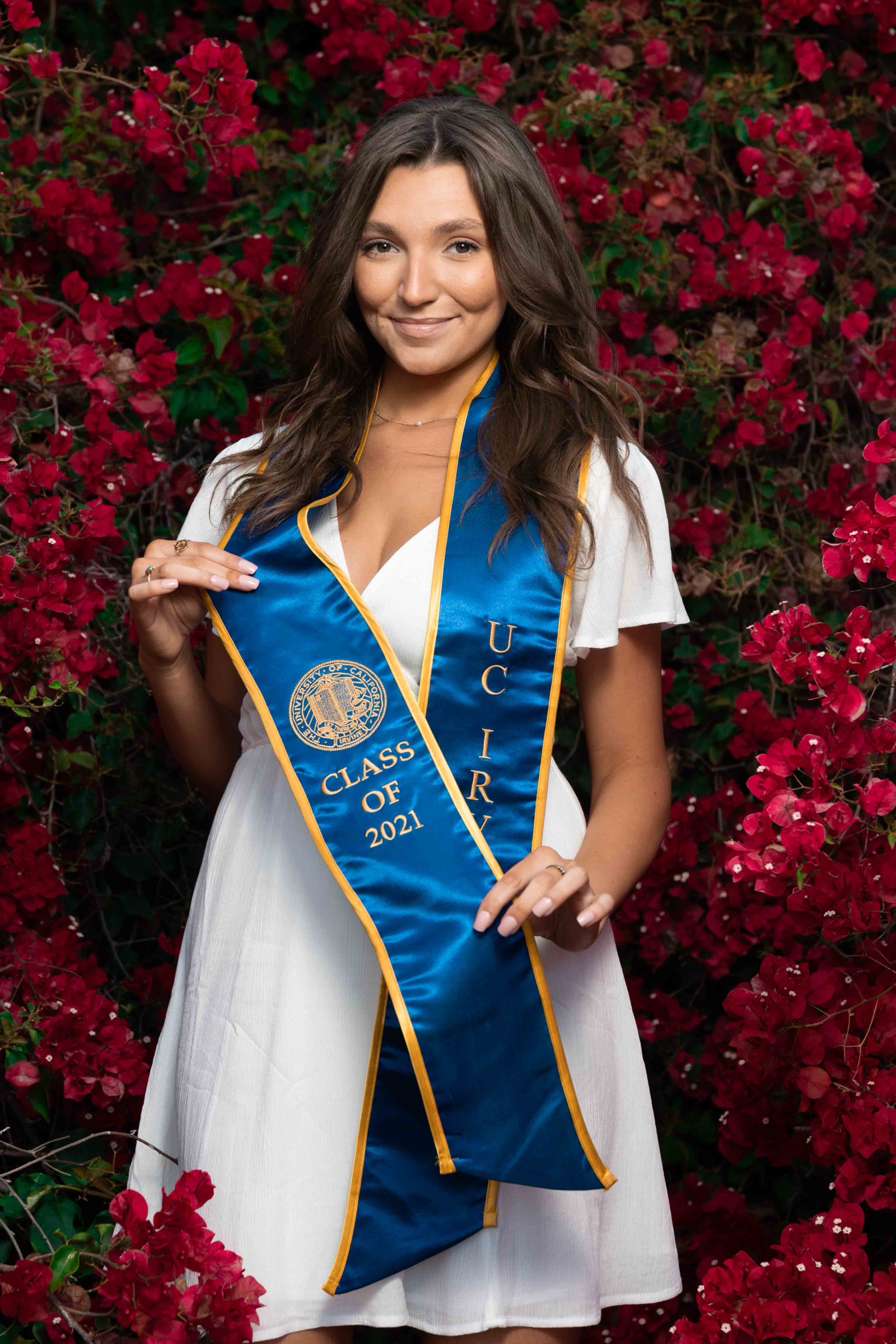 UCI grad with bougainvillea