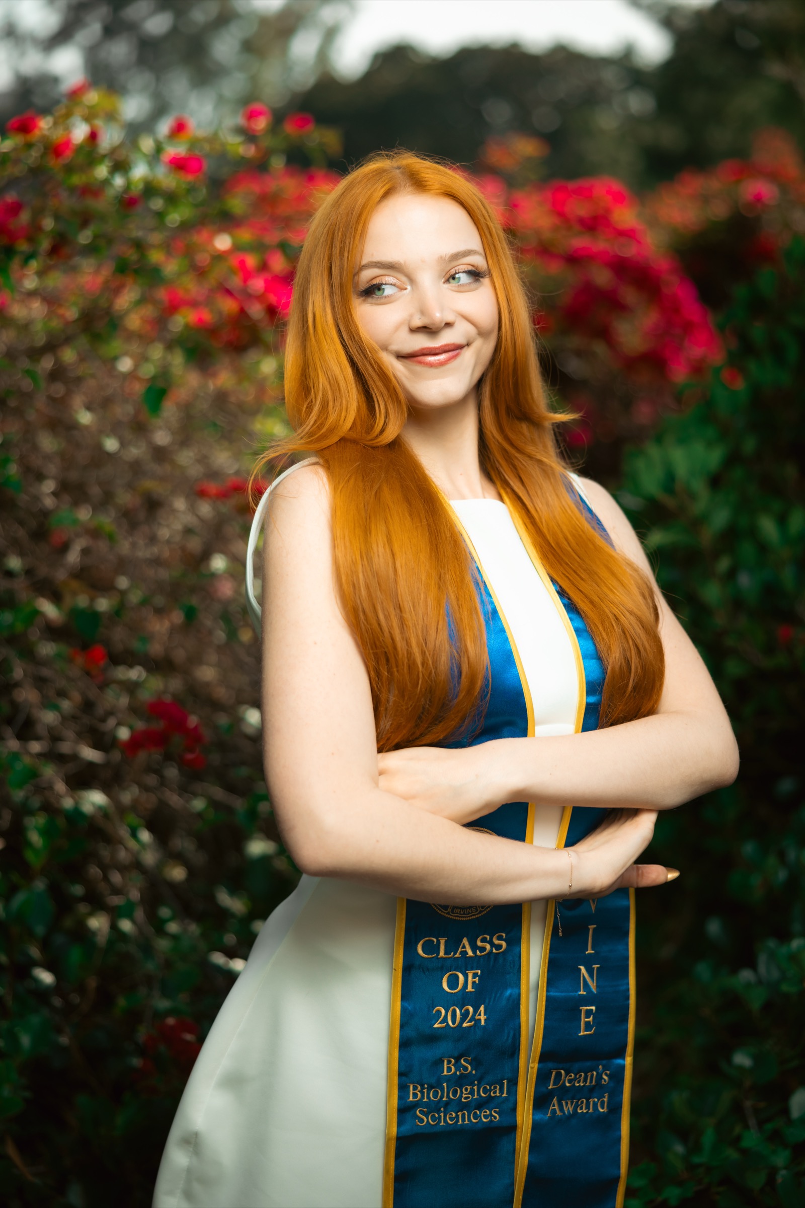 UCI graduate on park bench